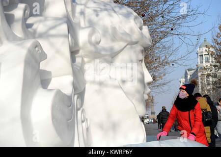 Harbin, China's Heilongjiang Province. 5th Jan, 2018. A tourist views an ice sculpture in Harbin, capital of northeast China's Heilongjiang Province, Jan. 5, 2018. Credit: Wang Kai/Xinhua/Alamy Live News Stock Photo