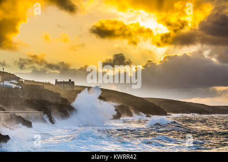 Porthleven, Cornwall, UK. 5th Jan, 2018. UK Weather. Westerly winds continue to push huge waves into Porthleven on the south west coast of Cornwall this morning at sunrise, before the winds swing round to the north east. The cliff path between Porthleven and Loe Bar is closed today due to a large cliff fall. Large waves are still causing ongoing damage. Credit: Simon Maycock/Alamy Live News Stock Photo