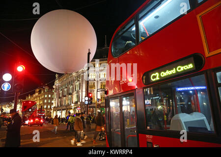 London, UK. 4th Jan, 2018. A giant inflatable balloon was installed at Oxford Circus to promote Lumiere London, but high winds made it a danger to buses and other traffic in the street Credit: Paul Brown/Alamy Live News Stock Photo