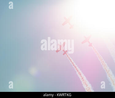 Synchronous Flight Synchronous flight in beams of the sun of four sparkling planes on air ...