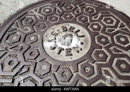 Close-up of telecommunications manhole cover with logo for telephone company Bell Systems, Concord, California, September 8, 2017. Stock Photo