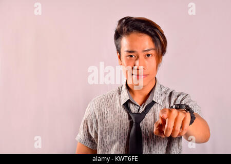 Indian male pointing at something at camera, Pune, Maharashtra Stock Photo