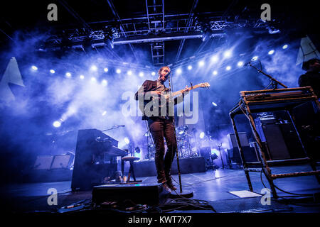 Lead singer and multi-instrumentalist Tom Smith from the British alternative rock band Editors pictured with his guitar live on stage in Tivoli, Copenhagen. Denmark 2013. Stock Photo