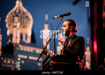 Lead singer and multi-instrumentalist Tom Smith from the British alternative rock band Editors pictured with his guitar live on stage in Tivoli, Copenhagen. Denmark 2013. Stock Photo