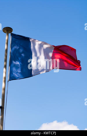 Flag of France (French: Drapeau français) is a tricolour flag featuring three vertical bands coloured blue (hoist side), white, and red. Oudoors, blue Stock Photo