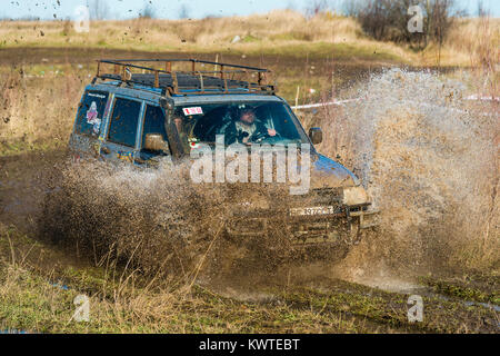 Lviv,Ukraine- December 6, 2015:Unknown rider on the off-road vehicle overcomes a route off road near the city of Lviv, Ukraine Stock Photo