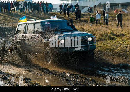 Lviv,Ukraine- December 6, 2015:Unknown rider on the off-road vehicle overcomes a route off road near the city of Lviv, Ukraine Stock Photo