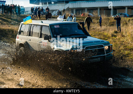 Lviv,Ukraine- December 6, 2015:Unknown rider on the off-road vehicle overcomes a route off road near the city of Lviv, Ukraine Stock Photo