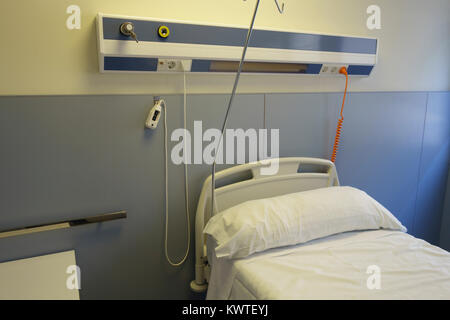 Empty bed in an hospital room Stock Photo