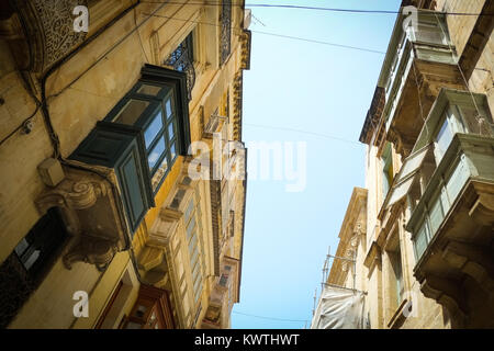 Traditional apartments with their wooden balconies, rot iron terraces, in Valetta, European Capital of Culture 2018, Malta. Stock Photo