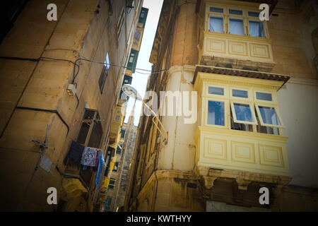 Traditional apartments with their wooden balconies, rot iron terraces, in Valetta, European Capital of Culture 2018, Malta. Stock Photo