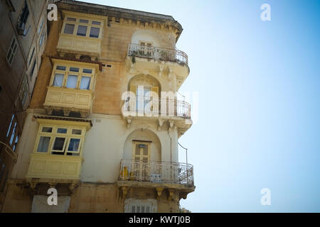 Traditional apartments with their wooden balconies, rot iron terraces, in Valetta, European Capital of Culture 2018, Malta. Stock Photo