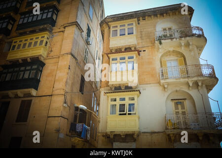 Traditional apartments with their wooden balconies, rot iron terraces, in Valetta, European Capital of Culture 2018, Malta. Stock Photo