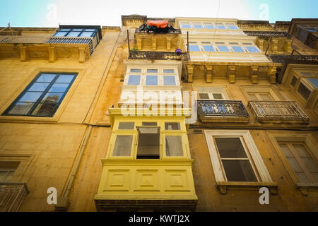 Traditional apartments with their wooden balconies, rot iron terraces, in Valetta, European Capital of Culture 2018, Malta. Stock Photo