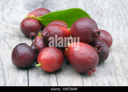 Cattley guava (Psidium littorale subsp. longipes) or Peruvian guava or Red Cherry Guava or Strawberry guava or Psidium cattleianum or Psidium chinense Stock Photo