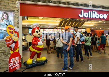 A Jollibee fast food outlet with the Jollibee bee mascot within SM City Mall,Cebu City,Philippines Stock Photo