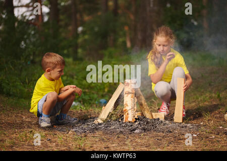 photo of happy children hiking in the forest Stock Photo