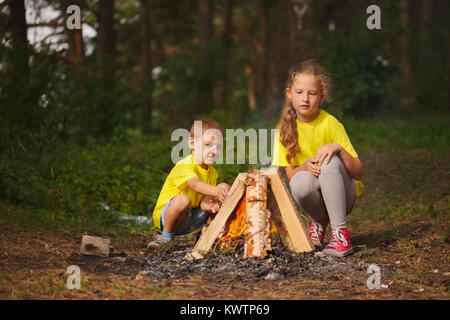 photo of happy children hiking in the forest Stock Photo