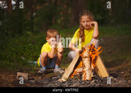 photo of happy children hiking in the forest Stock Photo