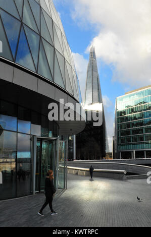An unusual or different view of city hall and the shard office buildings in London. Contemporary and alternative viewpoints on iconic landmarks. Stock Photo