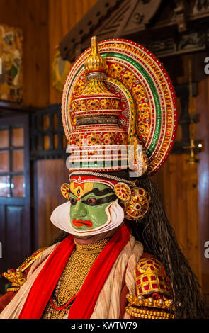 FORT COCHIN, India -  January 10, 2015: Kathakali performer in the virtuous pachcha role in Cochin on January 10, 2015 in South India. Kathakali is the ancient classical dance form of Kerala. Stock Photo