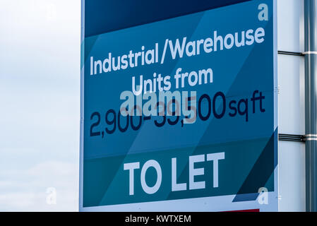 Estate agents industrial warehouse unit unit to let sign. Stock Photo