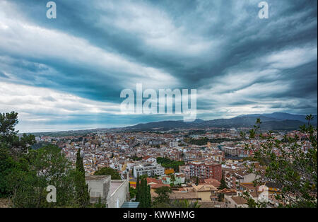 View from the top of the mountain in the central part of the city of Blanes in cloudy weather (Spain, Catalonia) Stock Photo