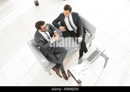view from the top. business partners discussing a contract Stock Photo