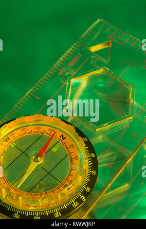 Macro-photo of compass rose face with needle, Outward Bound. Concept navigation, compass north west. Stock Photo