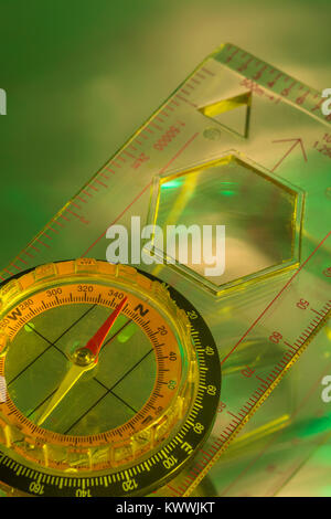 Macro-photo of compass rose face with needle. Outward Bound concept, navigation, compass north west. Stock Photo