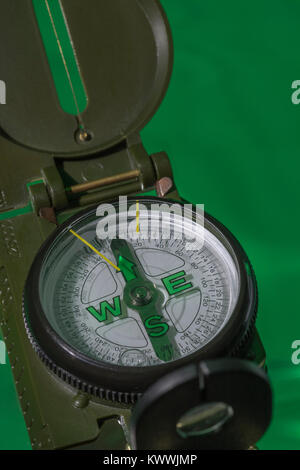 Macro-photo of compass rose face with needle, Outward Bound. Concept navigation, compass north. Stock Photo
