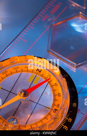 Macro-photo of compass rose face with needle. Outward Bound concept, navigation, compass north east. Stock Photo