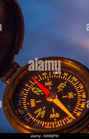 Macro-photo of compass rose face with needle - with copy space. Concept navigation, compass north. Stock Photo