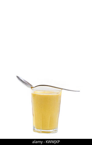 mustard sauce in jar with spoon on top isolated on white background Stock Photo