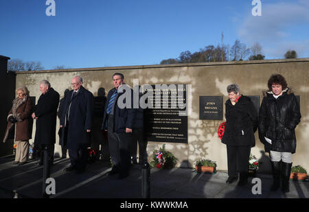 People attend a roadside service marking the 42nd anniversary of the shooting dead of 10 Protestant workmen by republicans at Kingsmill in South Armagh. Stock Photo