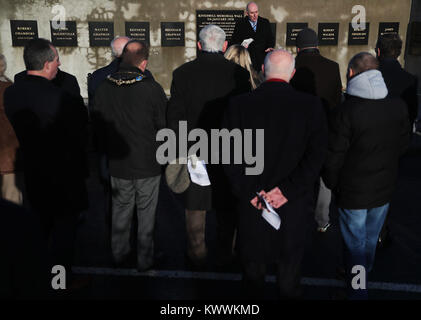 People attend a roadside service marking the 42nd anniversary of the shooting dead of 10 Protestant workmen by republicans at Kingsmill in South Armagh. Stock Photo