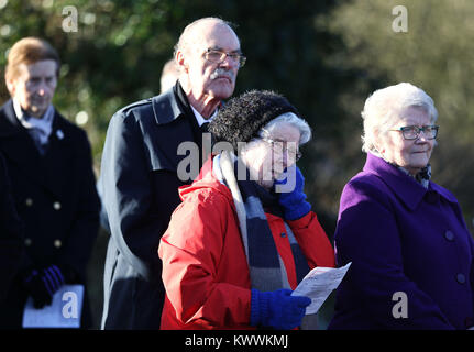 People attend a roadside service marking the 42nd anniversary of the shooting dead of 10 Protestant workmen by republicans at Kingsmill in South Armagh. Stock Photo