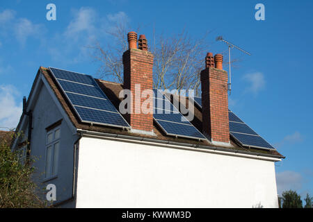 Solar panels fitted to roof of detached house in Hampshire, UK Stock Photo