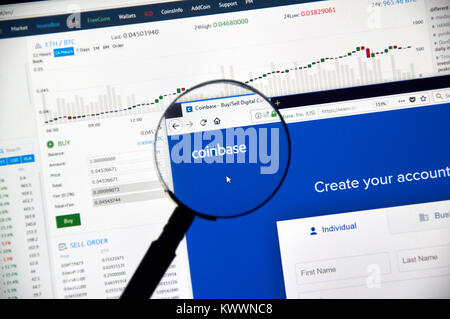 MONTREAL, CANADA - DECEMBER 23, 2017 : Coinbase cryptocurrency exchange website under magnifying glass Stock Photo