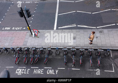 Woman standing alone on London street Stock Photo
