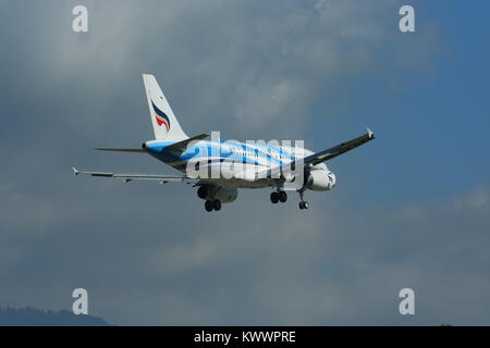 CHIANGMAI , THAILAND - JULY 10 2009: HS-PGS Airbus A319-100 of Bangkokairway. Landing to Chiangmai airport from Bangkok Suvarnabhumi. Stock Photo