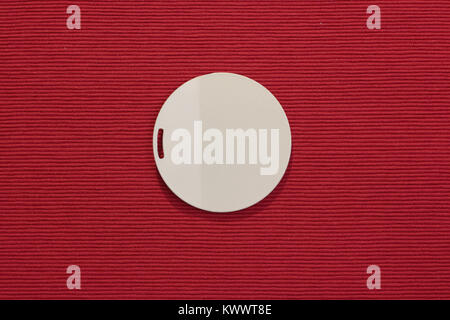 white circle on a red field, minimal concept, flat lay, copy space Stock Photo
