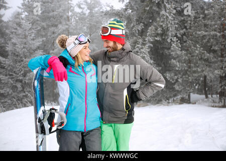 Happy couple on skiing in mountain Stock Photo