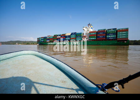 Container ship from China Shipping Line passing through the Panama Canal, Gatun lake, Republic of Panama. Stock Photo