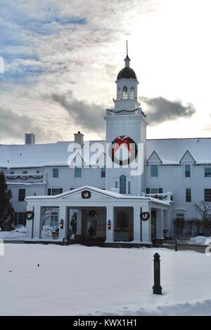 The historic grand Sagamore Hotel on Lake George in Bolton Landing, New York decorated for the holiday season and in the snow during the Winter. Stock Photo