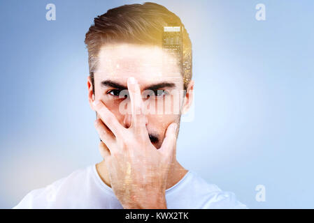 Portrait of a nice bearded man touching his face Stock Photo