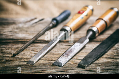 Old hand tools on a wooden background Stock Photo
