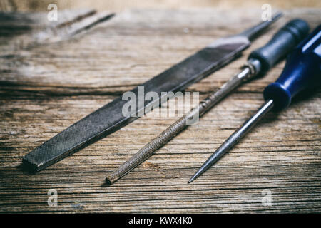Old hand tools on a wooden background Stock Photo