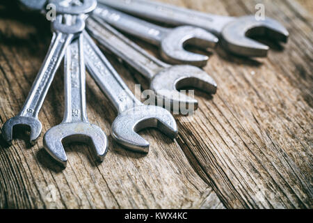 Set of wrenches on a wooden surface Stock Photo