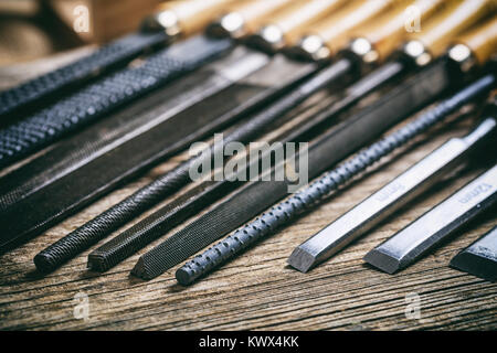 Old hand tools on a wooden background Stock Photo